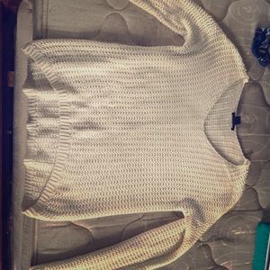 Knitted white sweater.